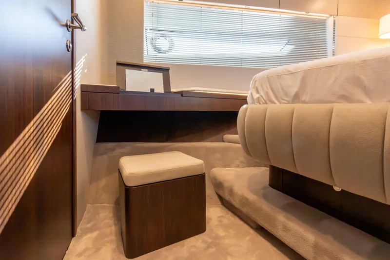 Slide: The Image of Luxury bar stools on Fairline Squadron 58 yacht, 2025 model, with sleek wooden deck. - 18