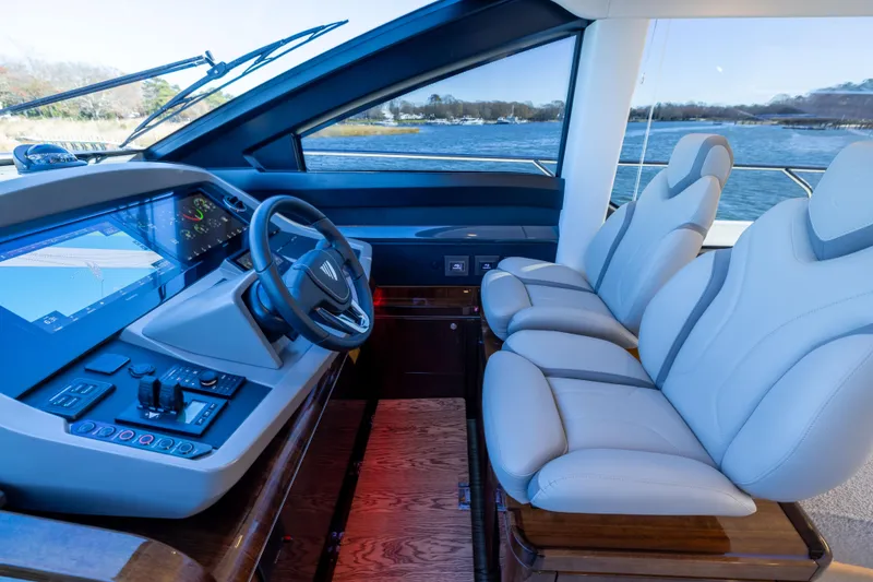 Slide: The Image of Luxurious helm of 2025 Fairline Squadron 58 yacht with modern controls and seating. - 34