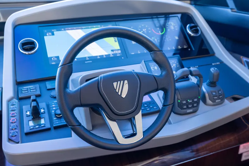Slide: The Image of Cockpit of 2025 Fairline Squadron 58 yacht with advanced navigation controls. - 38