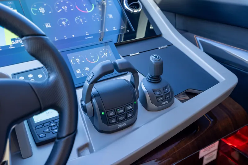 Slide: The Image of Cockpit controls of 2025 Fairline Squadron 58 yacht with advanced navigation displays. - 39