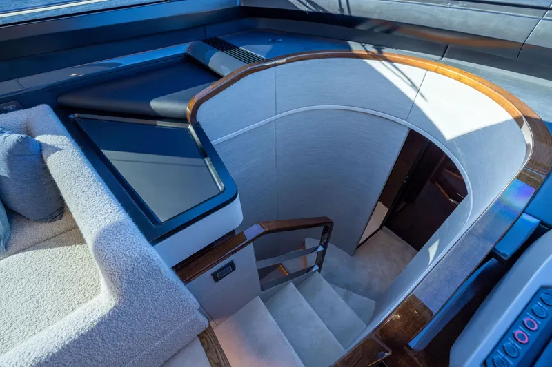 Slide: The Image of Interior of 2025 Fairline Squadron 58 yacht, featuring elegant staircase and modern design. - 41