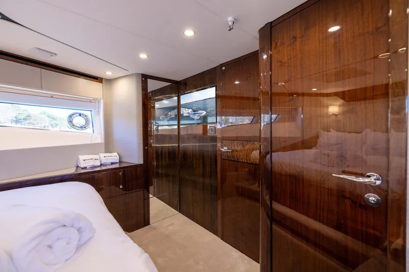 Slide: The Image of Luxurious interior of 2025 Fairline Squadron 58 yacht with polished wood finishes. - 45