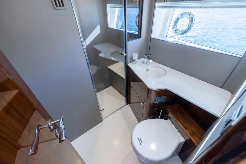 Slide: The Image of Luxurious bathroom in 2025 Fairline Squadron 58 yacht with modern fixtures and ocean view. - 47