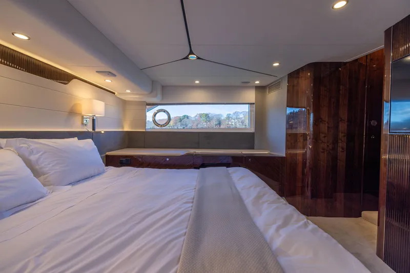 Slide: The Image of Luxurious bedroom interior of 2025 Fairline Squadron 58 yacht, featuring elegant design and comfort. - 52