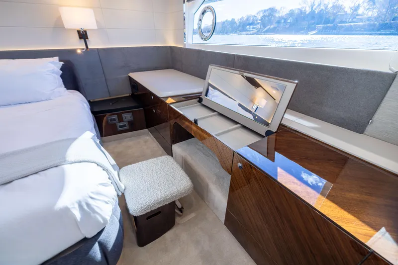 Slide: The Image of Luxurious interior of 2025 Fairline Squadron 58 yacht with elegant wood finishes and modern design. - 55