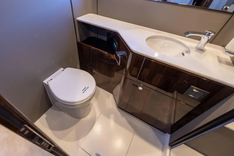 Slide: The Image of Luxury bathroom in 2025 Fairline Squadron 58 yacht, featuring modern fixtures and elegant design. - 60