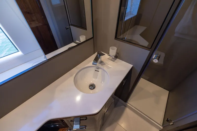 Slide: The Image of Luxury bathroom interior of 2025 Fairline Squadron 58 yacht, featuring modern sink and fixtures. - 61