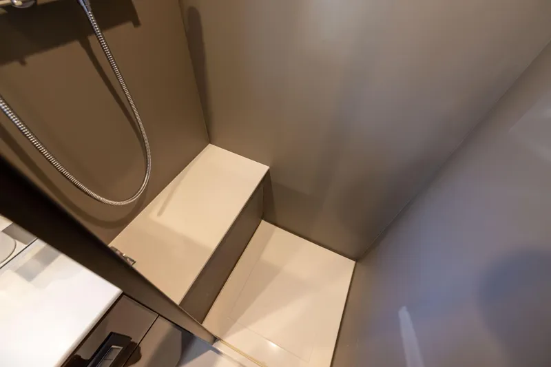 Slide: The Image of Shower area in 2025 Fairline Squadron 58 yacht, featuring modern design and fixtures. - 62
