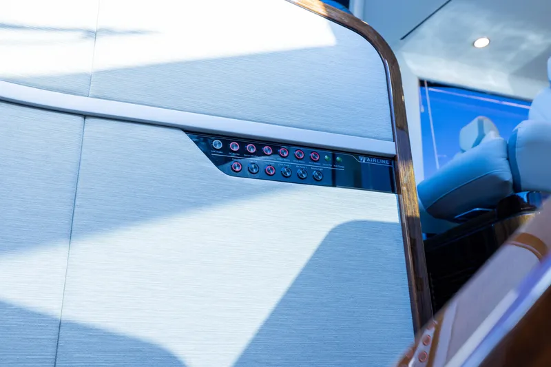 Slide: The Image of Control panel on 2025 Fairline Squadron 58 yacht interior, featuring sleek design and modern technology. - 64