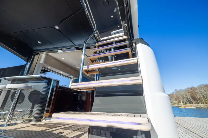 Slide: The Image of Staircase on 2025 Fairline Squadron 58 yacht, showcasing modern design and luxury features. - 71