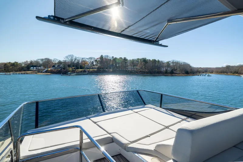 Slide: The Image of Luxurious 2025 Fairline Squadron 58 yacht deck with scenic waterfront view. - 74