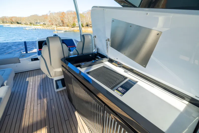 Slide: The Image of Luxurious 2025 Fairline Squadron 58 yacht interior with modern amenities and scenic water view. - 76
