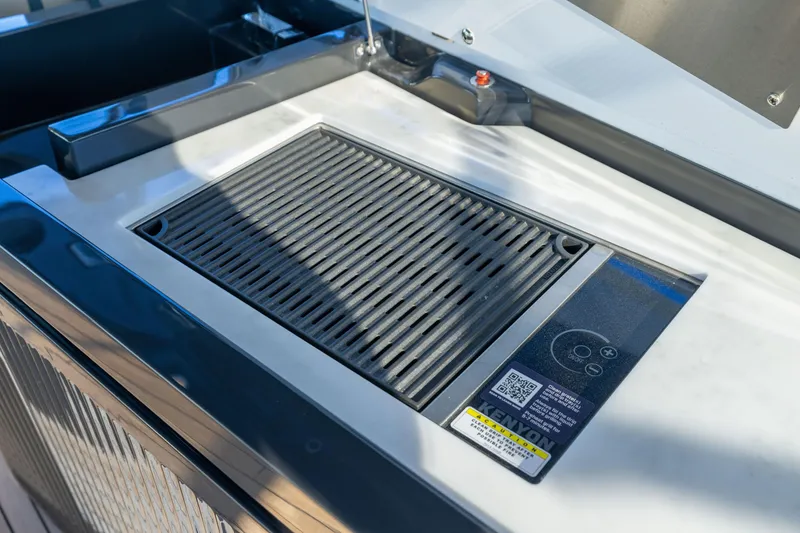 Slide: The Image of Built-in grill on 2025 Fairline Squadron 58 yacht, featuring sleek design and modern controls. - 77