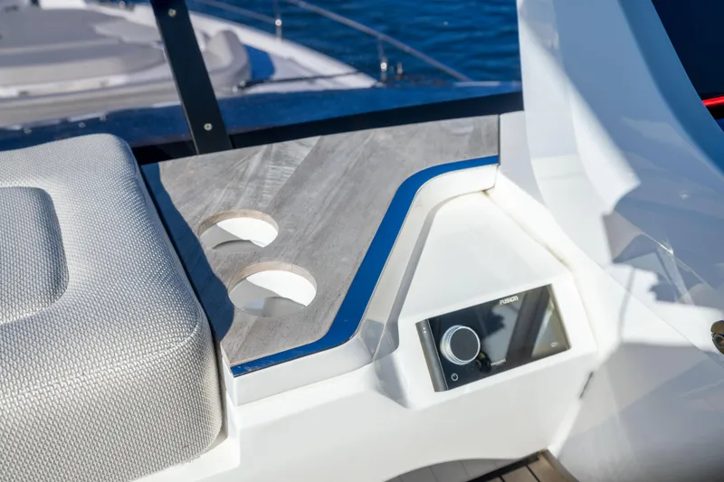 Slide: The Image of Luxury seating and control panel on 2025 Fairline Squadron 58 yacht. - 81