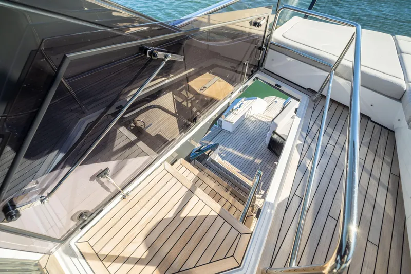 Slide: The Image of Luxury yacht Fairline Squadron 58, 2025 model, featuring elegant wooden deck and sleek design. - 85