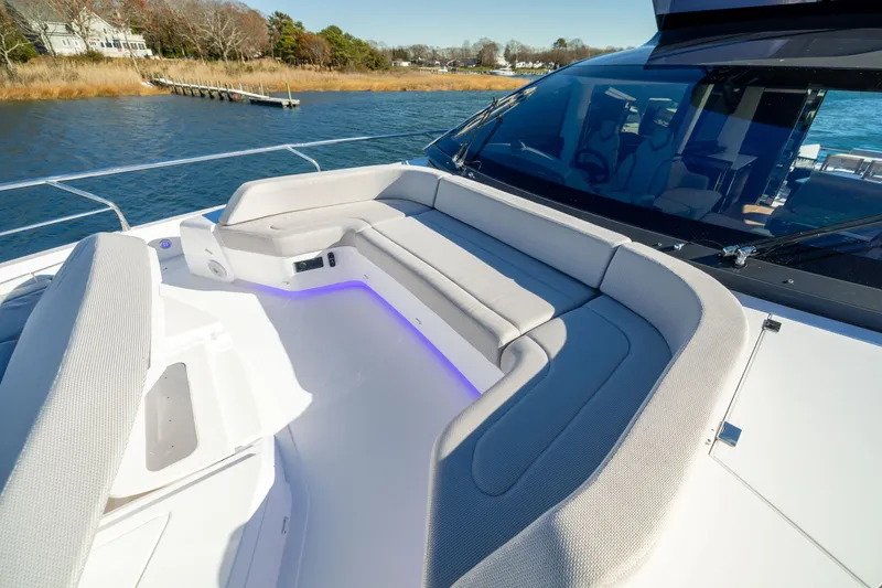 Slide: The Image of Luxurious seating area on 2025 Fairline Squadron 58 yacht, with scenic waterfront view. - 89