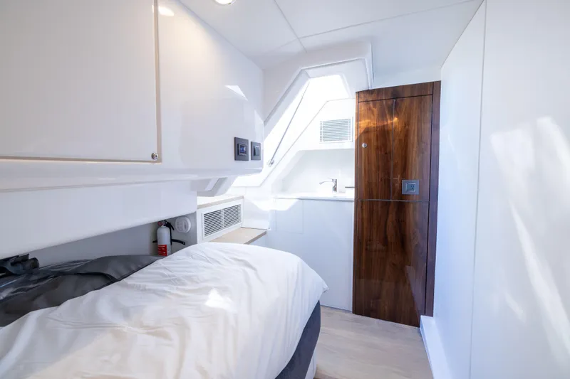 Slide: The Image of Luxurious cabin interior of 2025 Fairline Squadron 58 yacht, featuring sleek design and modern amenities. - 94