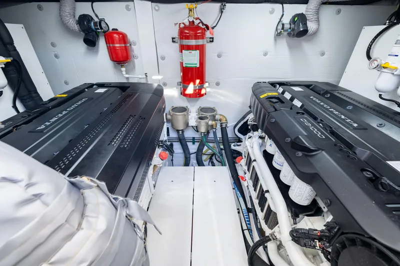 Slide: The Image of Engine room of 2025 Fairline Squadron 58 yacht with Volvo Penta engines and fire extinguisher. - 96