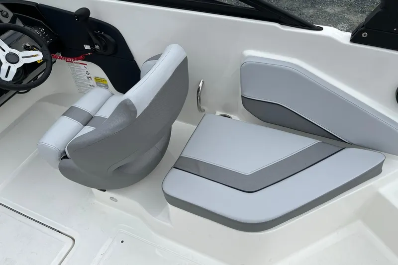 Slide: The Image of 2026 Bayliner V20 boat interior with modern seating and steering wheel. - 11