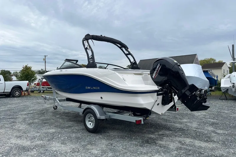 Slide: The Image of 2026 Bayliner V20 boat with Mercury engine on trailer, parked outdoors. - 3