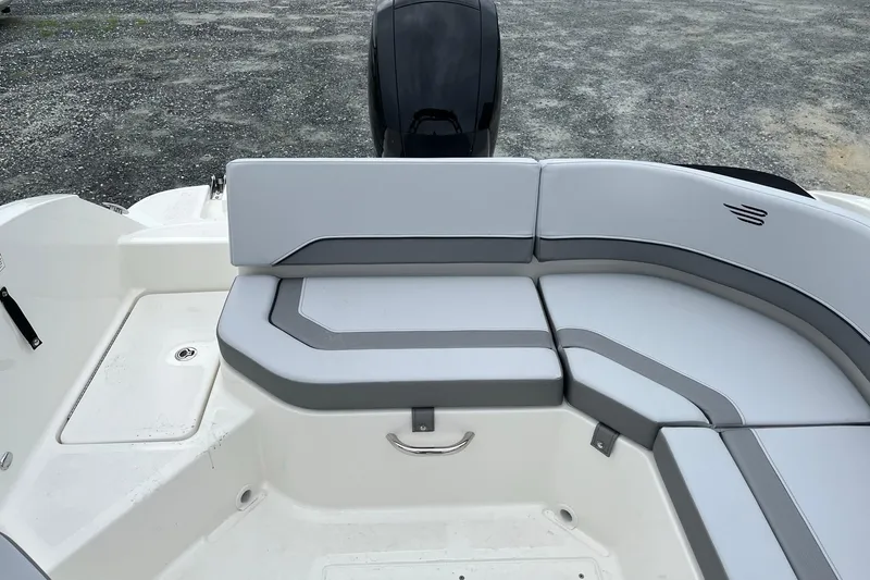 Slide: The Image of 2026 Bayliner V20 boat interior with gray seating and modern design. - 8