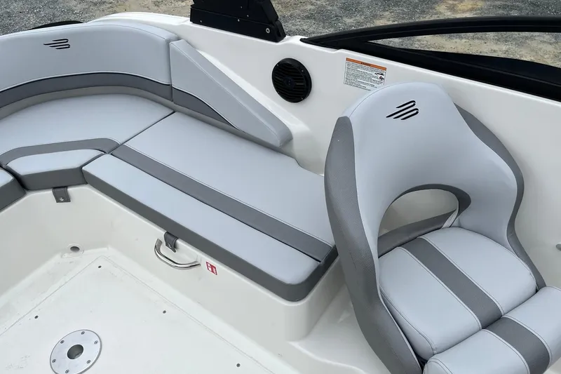 Slide: The Image of Bayliner V20 2026 boat interior with gray seating and modern design. - 9