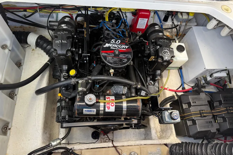 Slide: The Image of Engine compartment of a 2006 Bayliner 245 Cruiser with a 5.0L Mercury MerCruiser engine. - 13