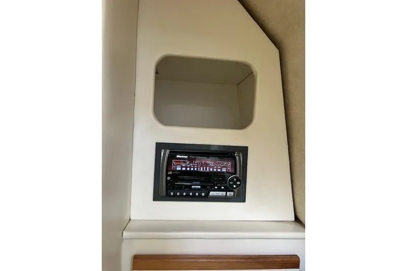 Slide: The Image of 1999 Bayliner 3055 Ciera Sunbridge interior with built-in stereo system. - 35