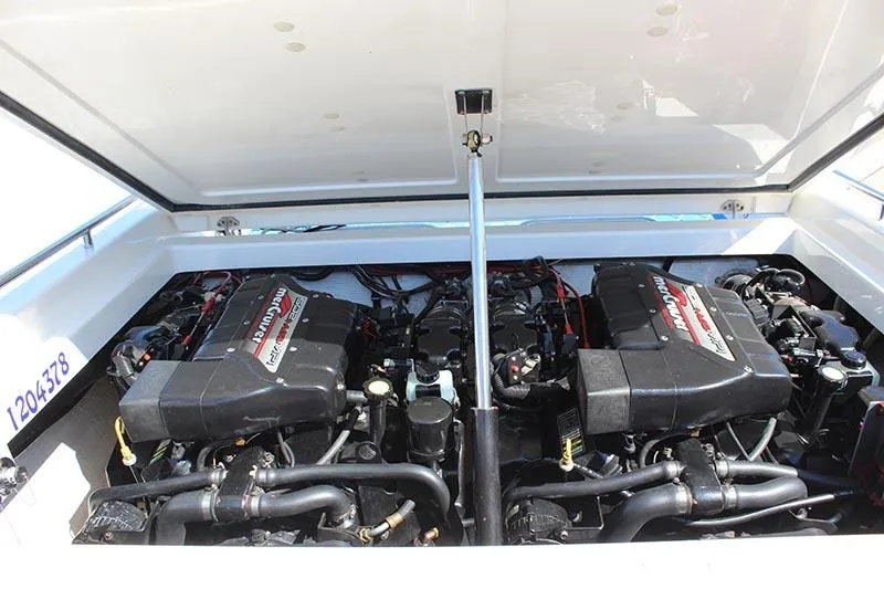 Slide: The Image of Engine compartment of a 2000 Fountain 32 Fever boat, showcasing dual engines. - 10