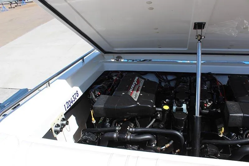 Slide: The Image of Engine compartment of a 2000 Fountain 32 Fever boat with open hatch. - 11