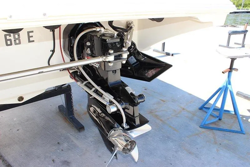 Slide: The Image of Rear view of a 2000 Fountain 32 Fever boat's outboard motor and propeller. - 18