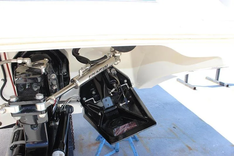 Slide: The Image of 2000 Fountain 32 Fever boat engine and steering mechanism on display. - 20