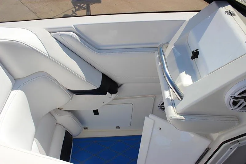 Slide: The Image of Interior of 2000 Fountain 32 Fever boat with white seating and blue flooring. - 36