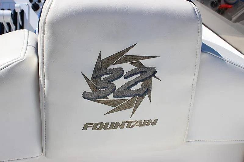Slide: The Image of Fountain 32 Fever 2000 model boat seat with embroidered logo design. - 37