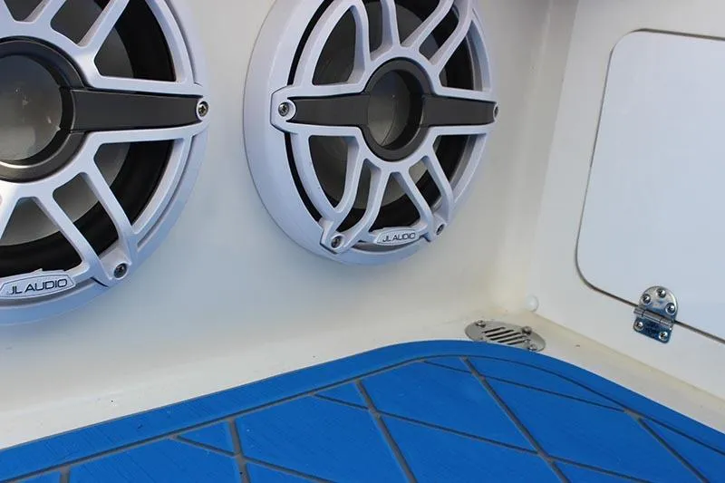 Slide: The Image of Speakers on a 2000 Fountain 32 Fever boat with blue flooring. - 41