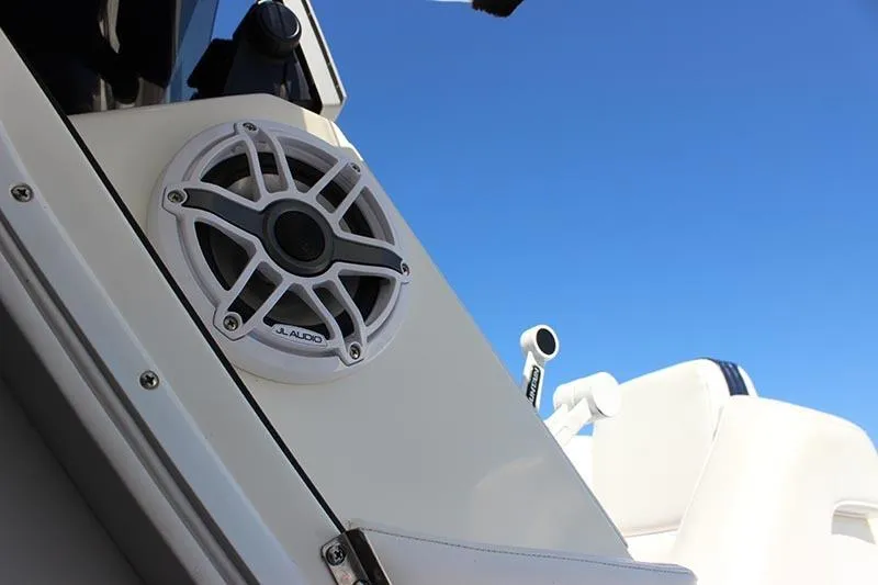 Slide: The Image of Speaker on a 2000 Fountain 32 Fever boat against a clear blue sky. - 42