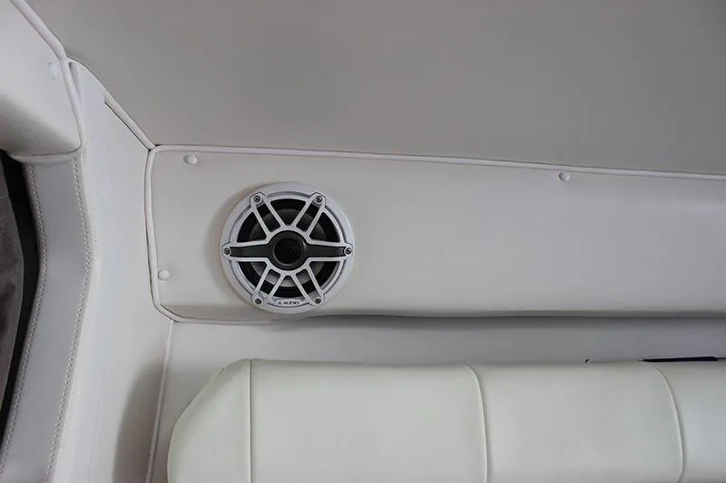 Slide: The Image of Interior of 2000 Fountain 32 Fever boat with white speaker and upholstery. - 49