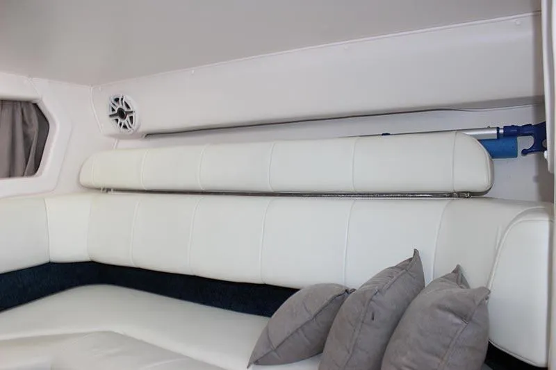 Slide: The Image of Interior of 2000 Fountain 32 Fever boat with white seating and gray pillows. - 50