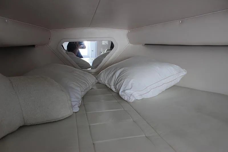 Slide: The Image of Interior cabin of 2000 Fountain 32 Fever boat with pillows and mirror. - 52