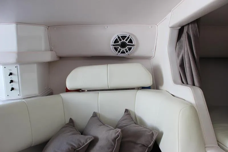 Slide: The Image of 2000 Fountain 32 Fever boat interior with white seating and gray cushions. - 62
