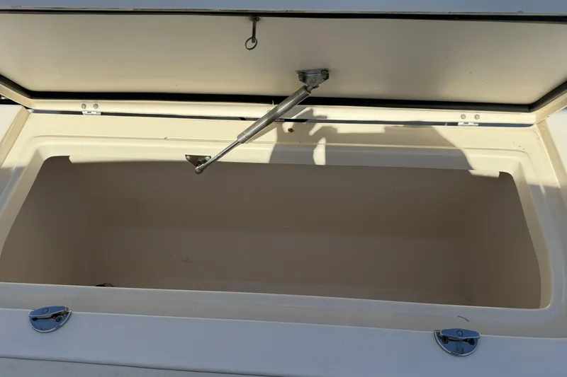 Slide: The Image of Open storage compartment on a 2014 Grady-White Freedom 275 boat. - 14