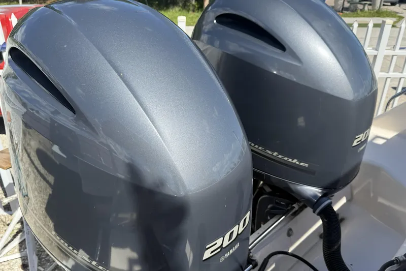 Slide: The Image of Twin Yamaha 200 outboard engines on a 2014 Grady-White Freedom 275 boat. - 16