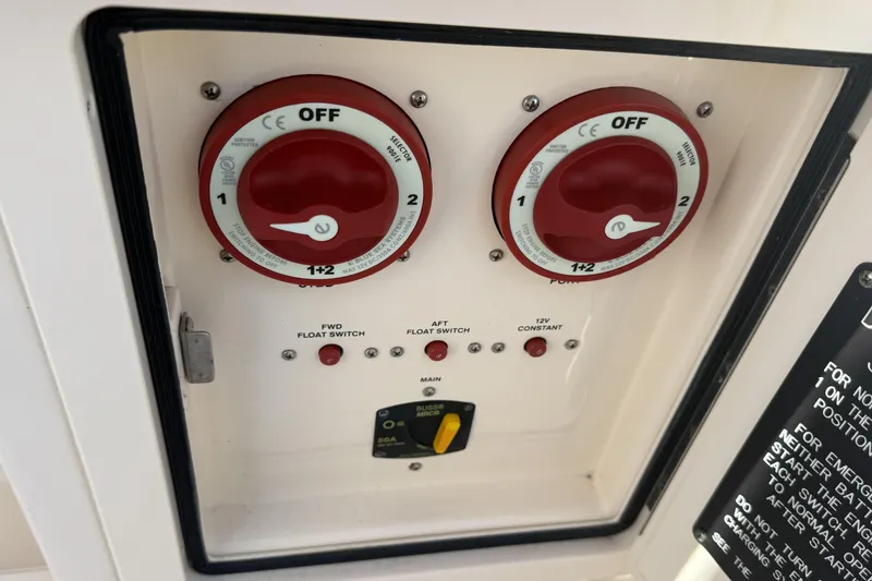 Slide: The Image of Control panel of a 2014 Grady-White Freedom 275 boat with battery switches. - 18