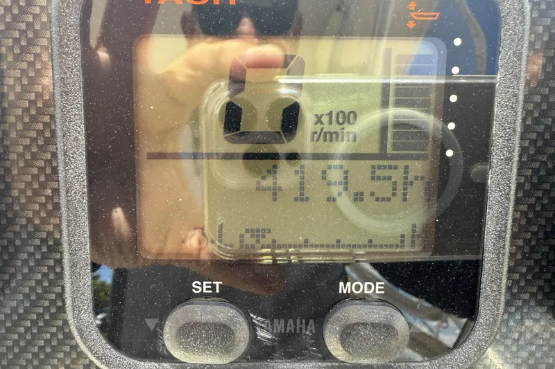 Slide: The Image of Close-up of a Grady-White Freedom 275 tachometer displaying 419.5 hours. - 4