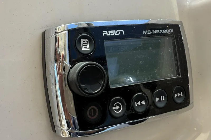 Slide: The Image of Fusion MS-NRX200i marine stereo control on 2014 Grady-White Freedom 275 boat. - 6