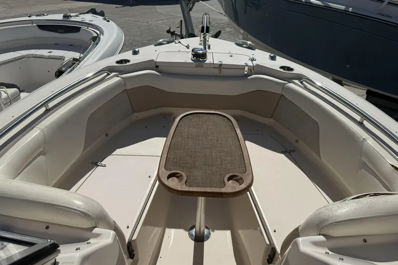 Slide: The Image of 2014 Grady-White Freedom 275 boat interior with seating and table. - 8