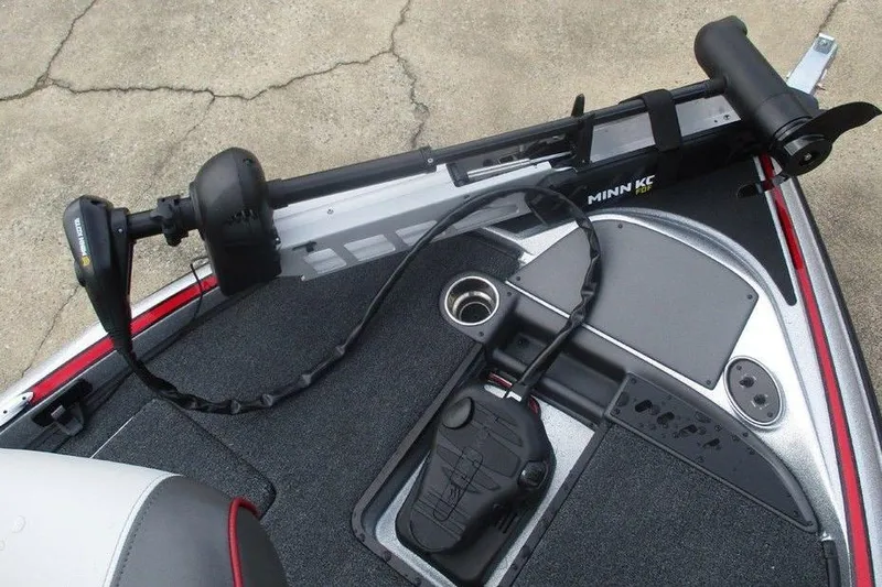 Slide: The Image of 2026 Triton 179 TrX boat deck with Minn Kota trolling motor and control panel. - 4