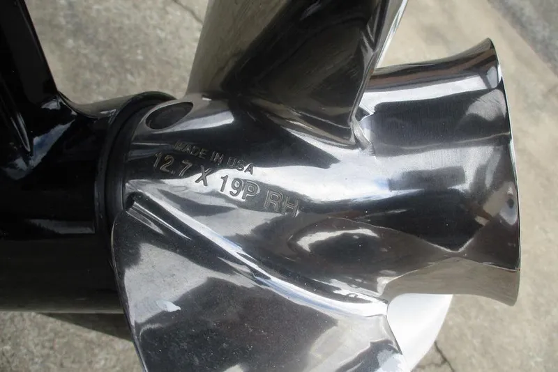 Slide: The Image of Close-up of a shiny boat propeller with engraved specifications, Triton 179 TrX 2026 model. - 9