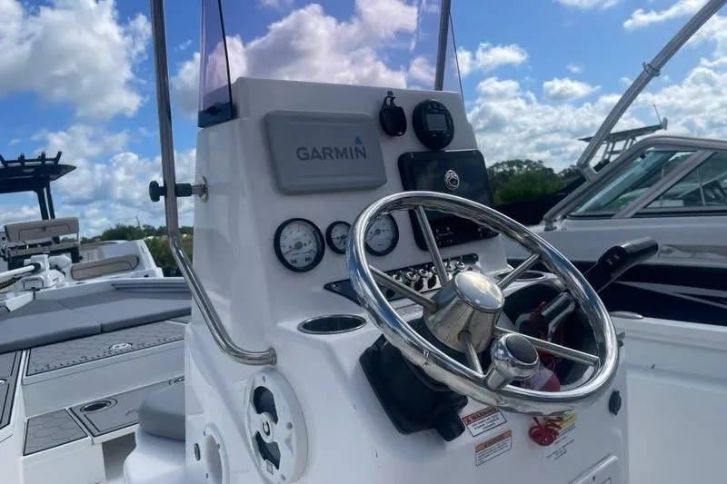 Slide: The Image of Steering console of 2021 Avid 23 Fusion boat with Garmin navigation system. - 8