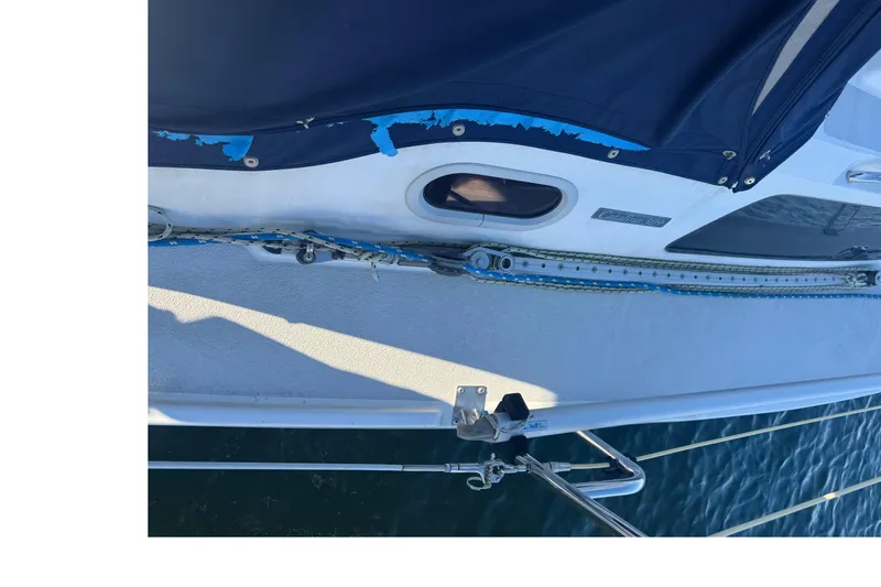 Slide: The Image of Catalina 309 sailboat deck view, featuring rigging and blue canvas, 2006 model. - 1